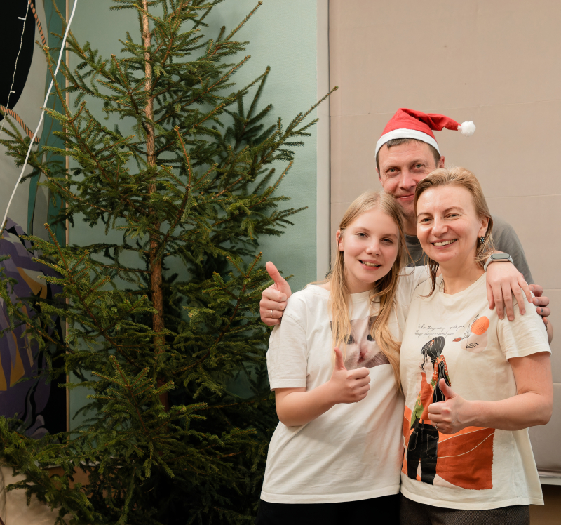 The Silantev family in festive spirit with the fir tree in the background!