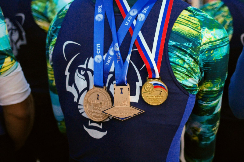 A member of ITMO’s rowing club poses with first-place medals at the 2020 Student Rowing League Championship. Credit: ITMO University
