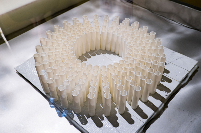 A prototype of the new donut-shaped noise-insulating structure. The solution is made up of pairs of coupled Helmholtz resonators – 3D-printed vertically-oriented tubes with an opening on one side. The structure is translucent and vented. In the future, researchers plan to run tests on a prototype with larger resonators. Photo by Liliya Kichigina / ITMO’s School of Physics and Engineering
