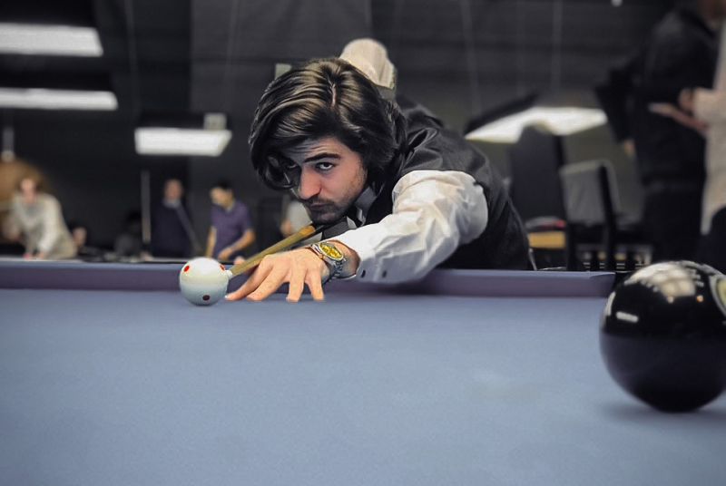 “Playing billiards is one of my hobbies,” says Ramin. Photo courtesy of the subject
