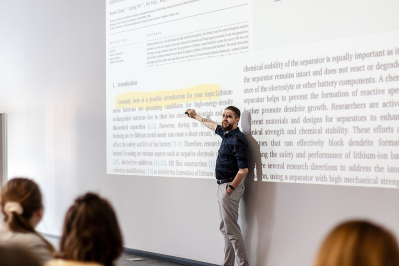 Dmitry Sinev with a talk about AI tools. Credit: Maria Bakina, Pavel Arseev / ITMO's Mediaportal
