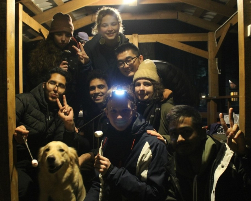 Haithem with his human friends and a furry friend at Yagodnoe. Photo courtesy of the subject
