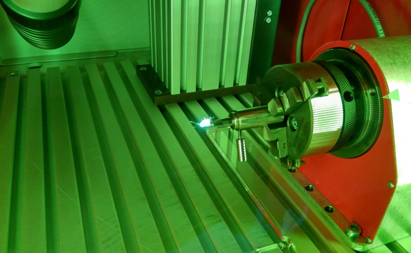 The process of laser processing through a safety glass. Image provided by the staff of the international laboratory “Laser Micro- and Nanotechnologies”